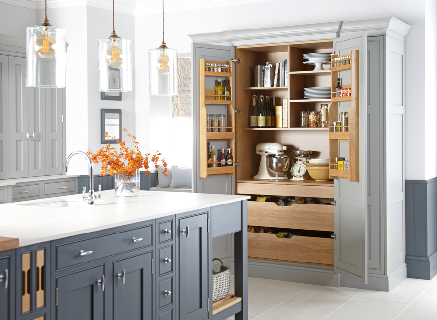 a modern, country style kitchen. Grey with orange accents